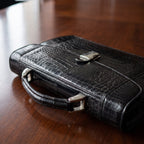 Alligator Briefcase, close-up of the hardware and stitching