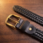 The Braided Leather Belt in Black, close-up of the buckle end [Black]