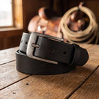 The Longhorn Belt in Black, on a ranch tack-room table [Black]