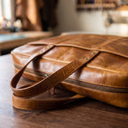 Oiled Leather Briefcase in Tan, close-up of the hardware and stitching [Tan]