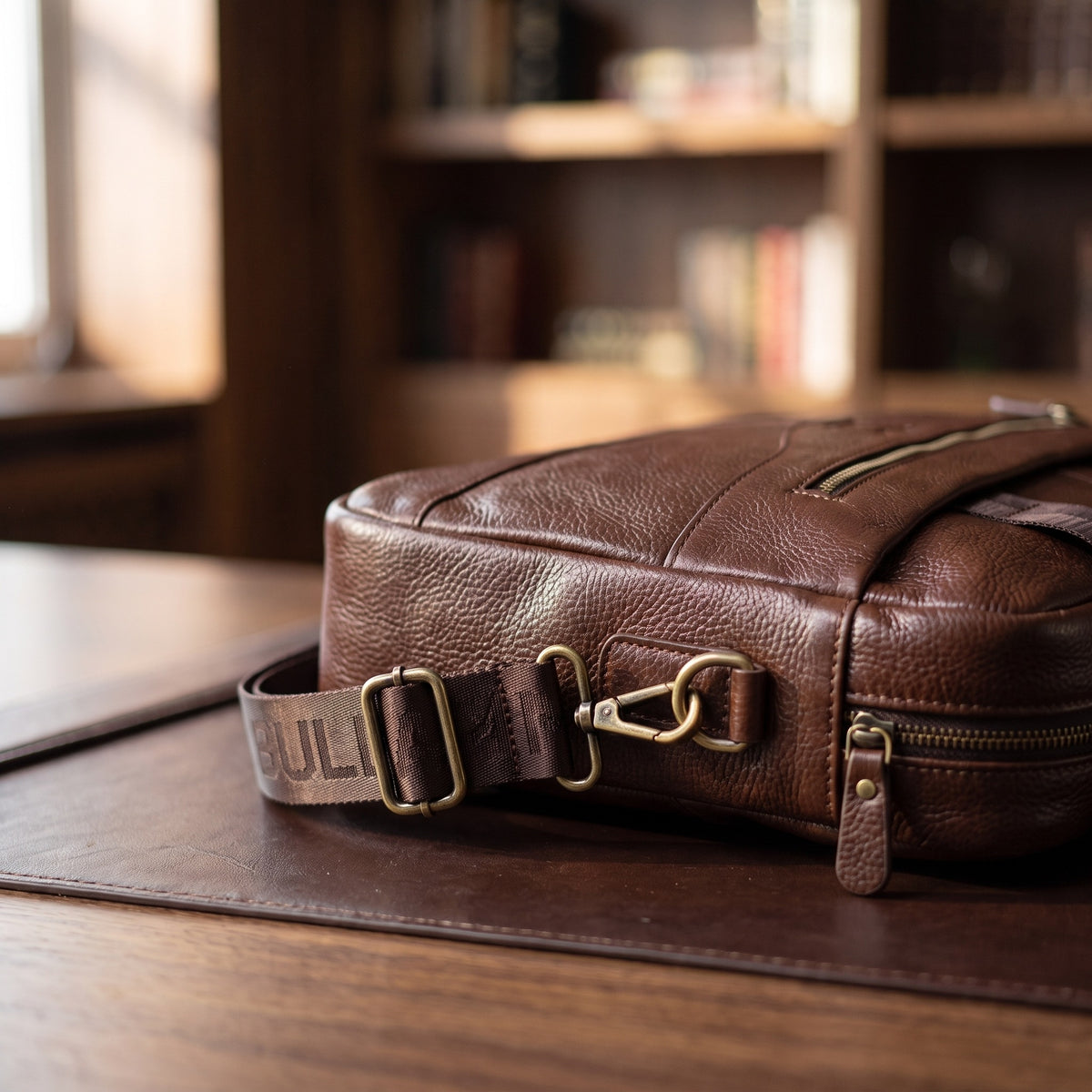 Pebbled Leather Briefcase in Oxblood, close-up of the hardware and stitching [Oxblood]