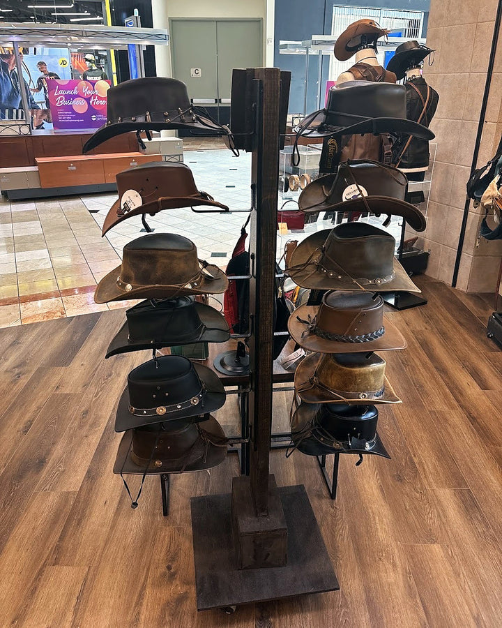 Leather cowboy hats on the hat rack